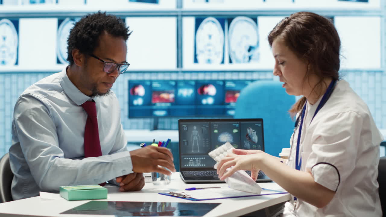 Doctor giving woman a pill from the medicine tablet to start treatment