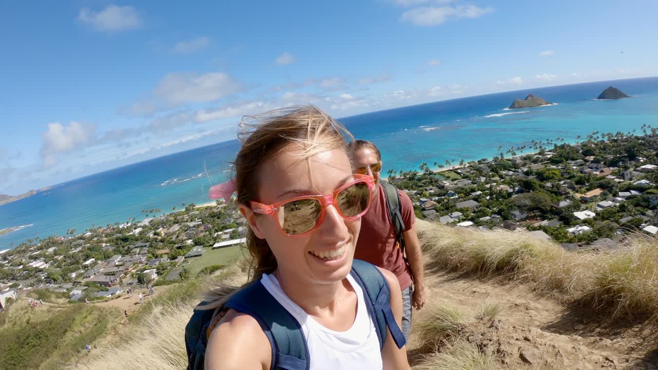 POV selfie style, couple hiking in Hawaii. Young couple on a hike in Hawaii