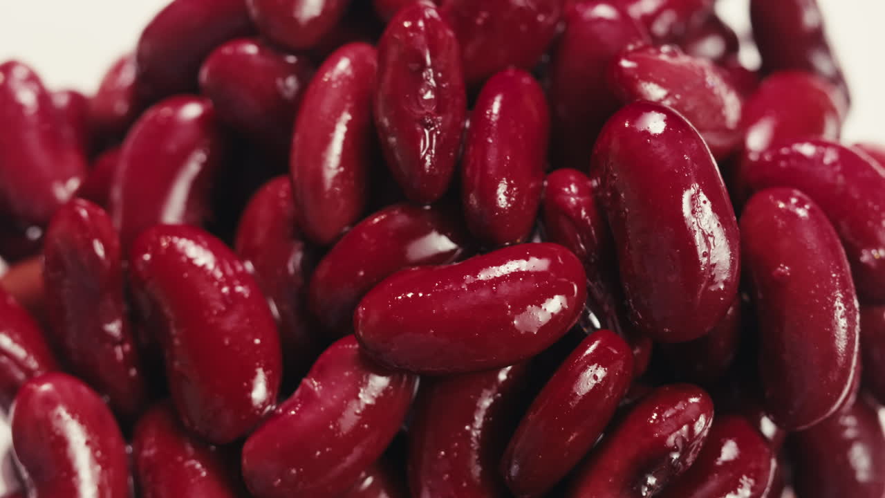 Canned red bans preserved beans rotating background close up side view. Organic steamed beans. Pickled bean for a Mexican dish
