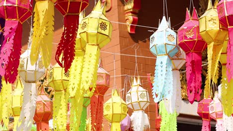 colorful lanterns swaying in the breeze