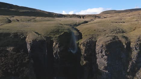 Stunning-4K-Drone-Footage-of-Devil's-Chimney-blowing-the-water-backwards-up-of-the-Cliff---Co