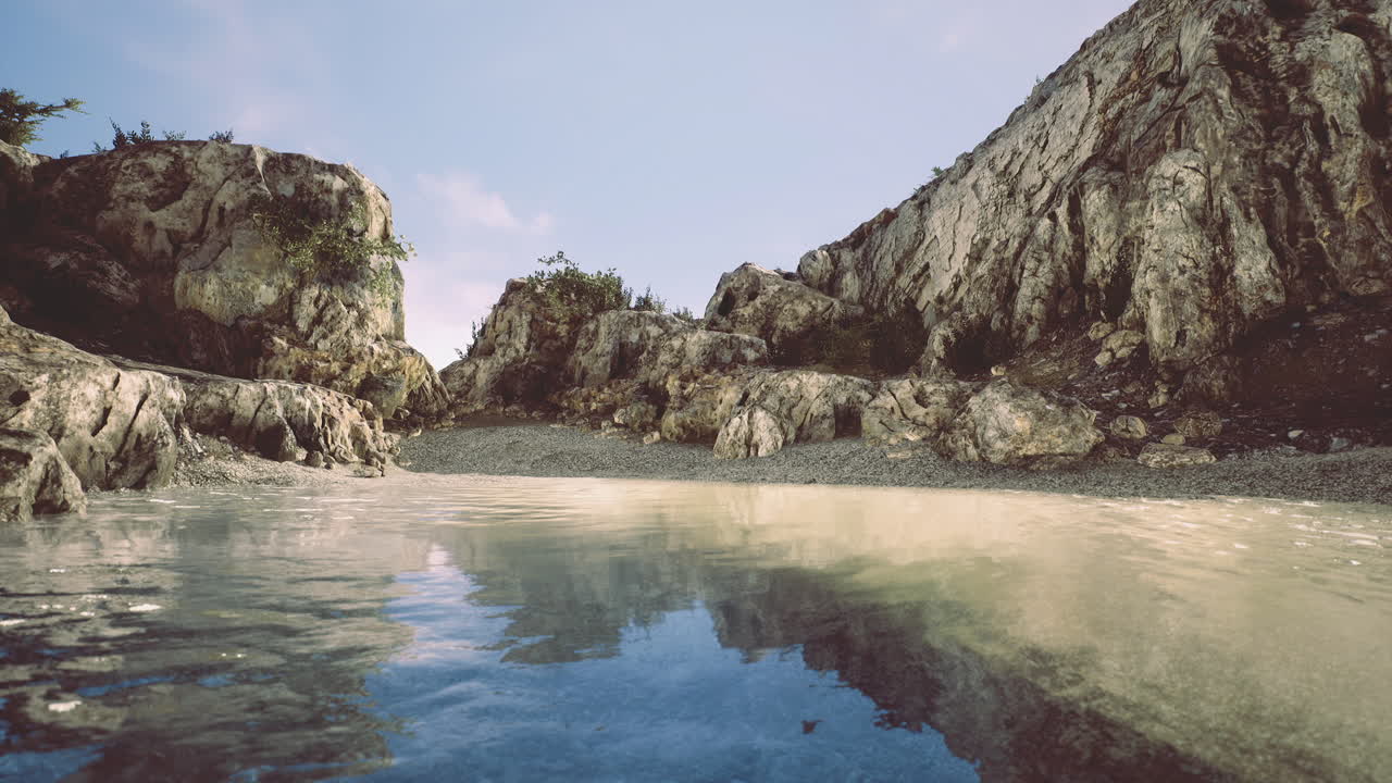 Serene coastal landscape with rocky formations reflecting in calm water