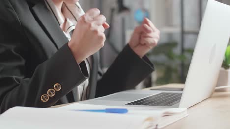 business woman celebrating success during online meeting