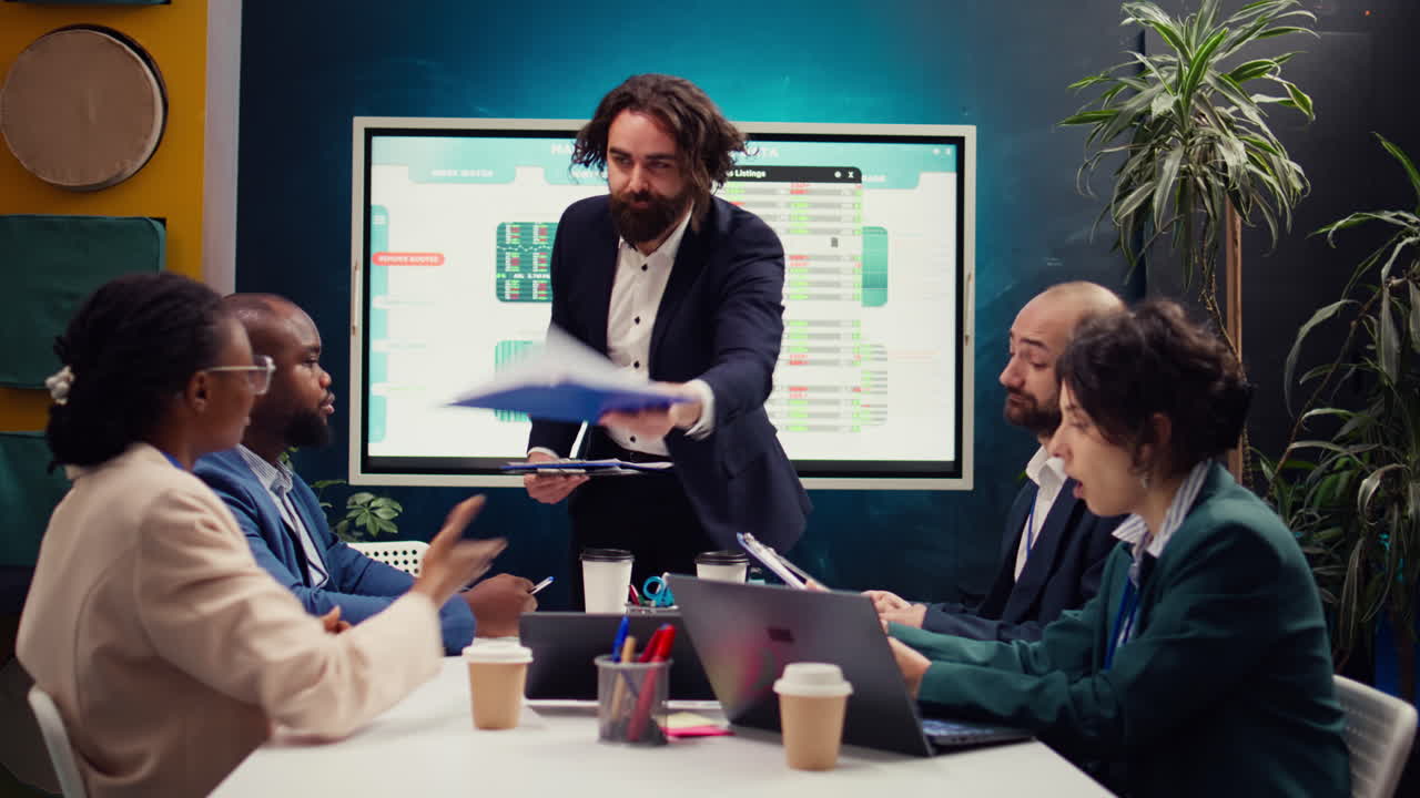 Staff supervisor provides clipboards with current data on performance