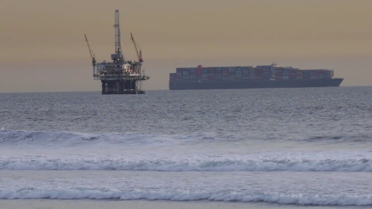 Offshore oil drilling and cargo ship in Southern California