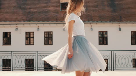 woman wearing a light gray tulle skirt