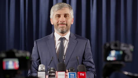 portrait of cheerful politician at press conference