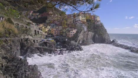 Panoramic-view-of-Manarola,-Cinque-Terre,-during-a-sea-storm