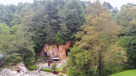 4K-Drone-Video-of-Mining-Cave-at-Emerald-Village-near-Little-Switzerland,-NC-on-Summer-Day-1