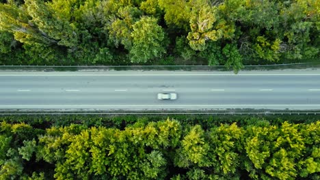 aerial view of road junction with moving cars. road interchange or highway intersection with busy urban traffic speeding on the road.