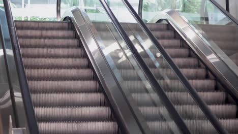 a stationary view of an escalator in motion