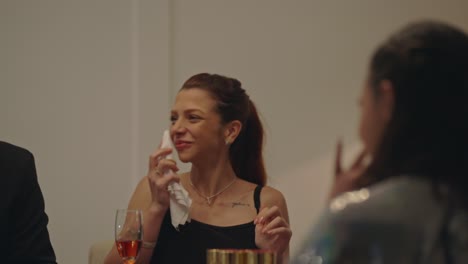 people enjoying a social gathering at a table