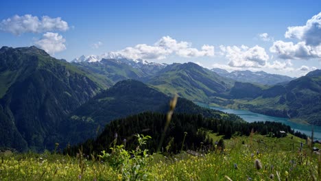 timelapse panoramic view of mont blanc mountains and roselend lake dam in france, auvergne-rhône-alpes region in springtime