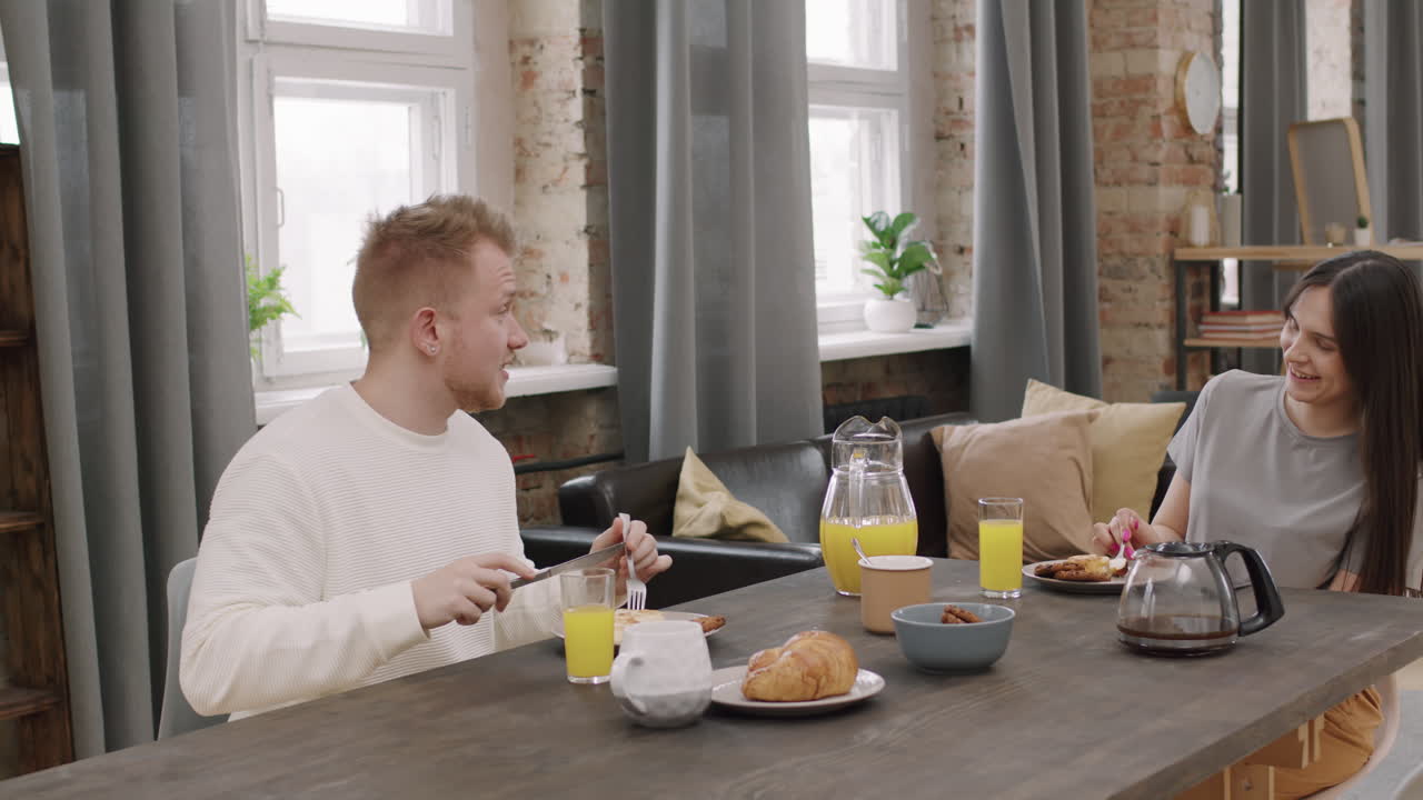 Happy Couple Chatting and Having Breakfast