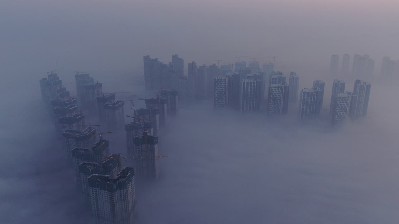 A city that seems to be floating in the air with fog and dust