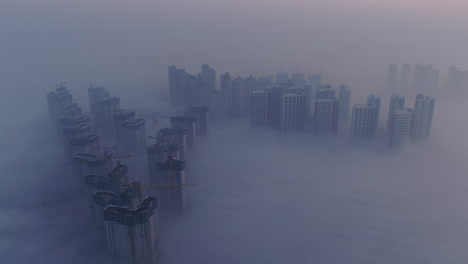 a city that seems to be floating in the air with fog and dust