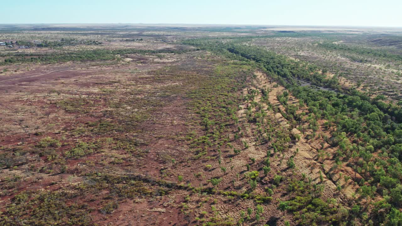Sideways aerial view of the Victoria River and landscape near Kalkarindji, Gurindji, Northern Territory, Australia, August 2022.