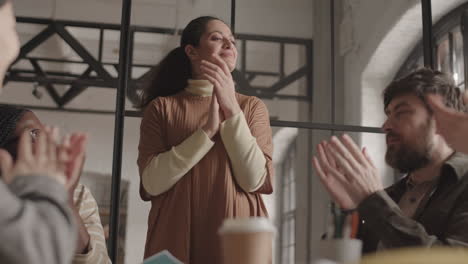 colleagues applauding to business idea