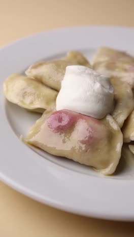 pierogi with sour cream