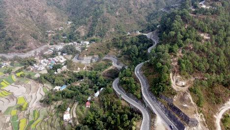 Drone-footage-of-the-BP-Highway,-Bardibas-Highway,-in-the-hills-and-mountains-of-Nepal