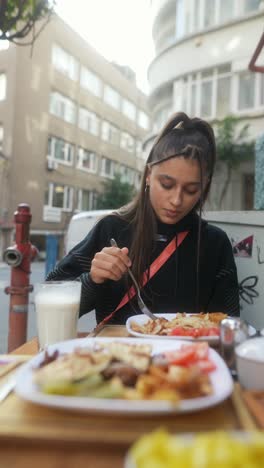 teenage girl eating turkish street food