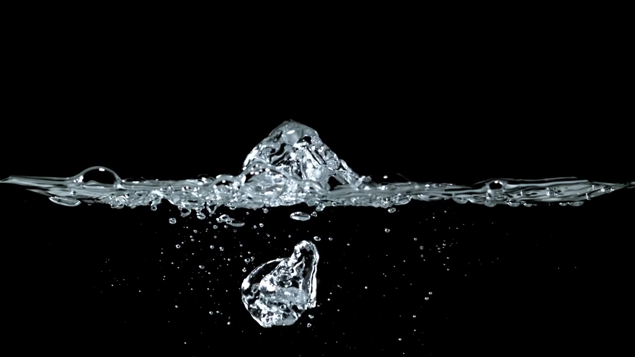 Slow Motion Water Bubbles Rising and Bursting on Black Background