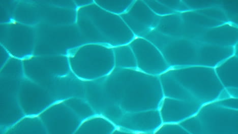 Refracted-light-patterns-on-bottom-of-swimming-pool