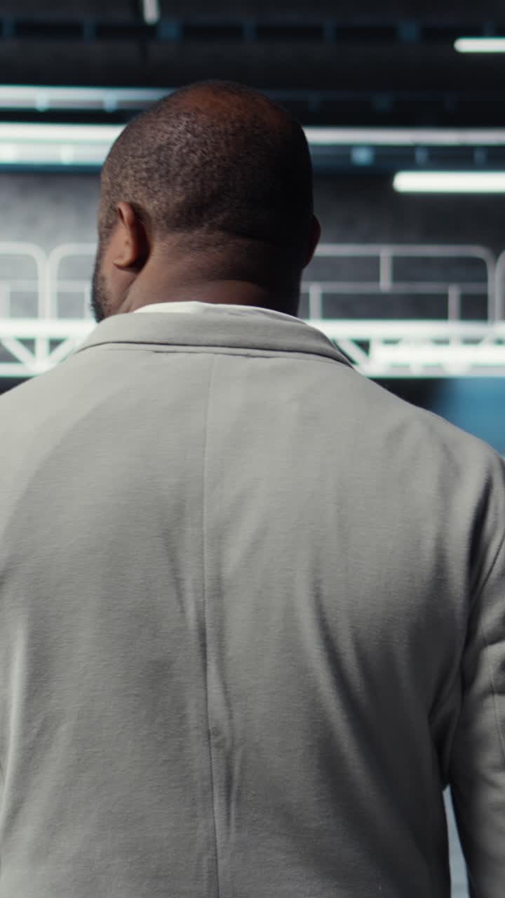 Vertical video System administrator in data center doing inspection on infrastructure tech