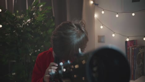 a young boy looks through his telescope at the night sky, then lifts his head with a look of pure amazement and wonder. a concept of childhood discovery and passion for science