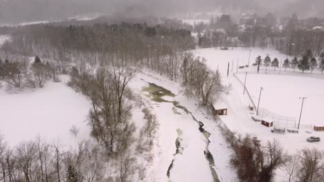 Snowy Frozen River and Countryside Aerial Near Sherbrooke