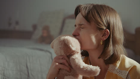 a girl playing with dolls in her room