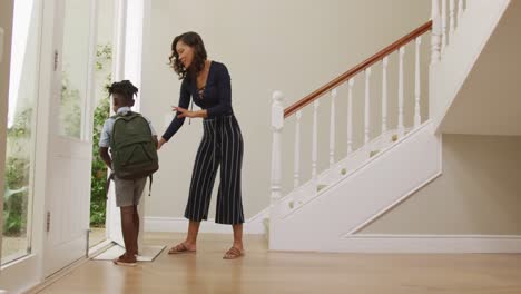 Mother-saying-goodbye-to-her-son