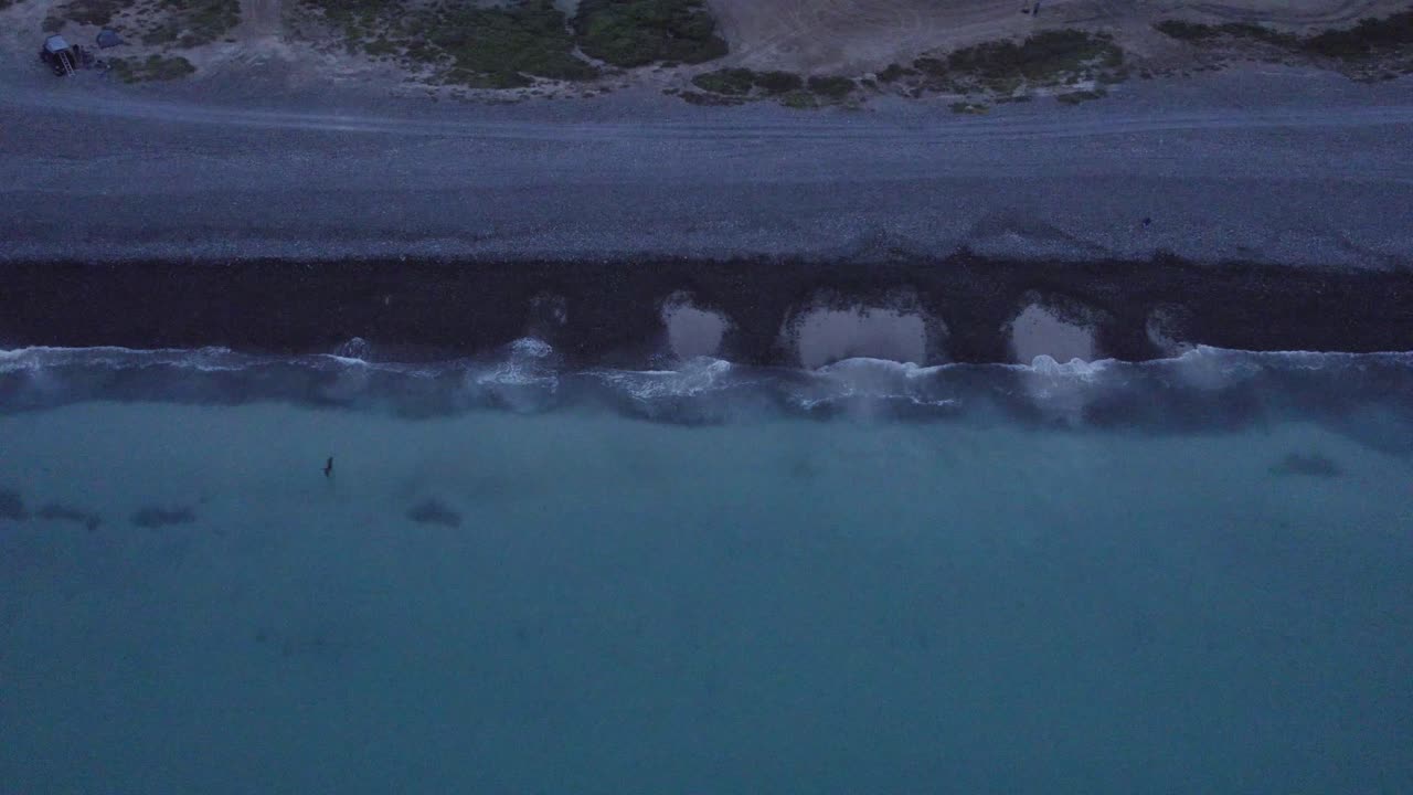 big bird flight static drone view of beach and waves at a cloudy morning in Cabo Pulmo, Mexico