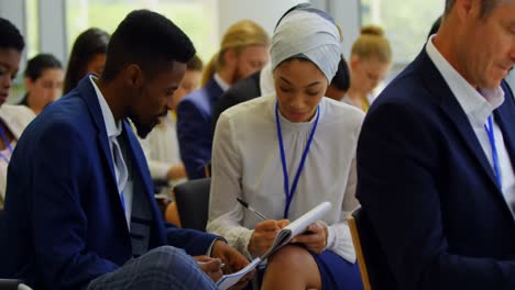 Multi-ethnic-business-people-attending-a-business-seminar-4k