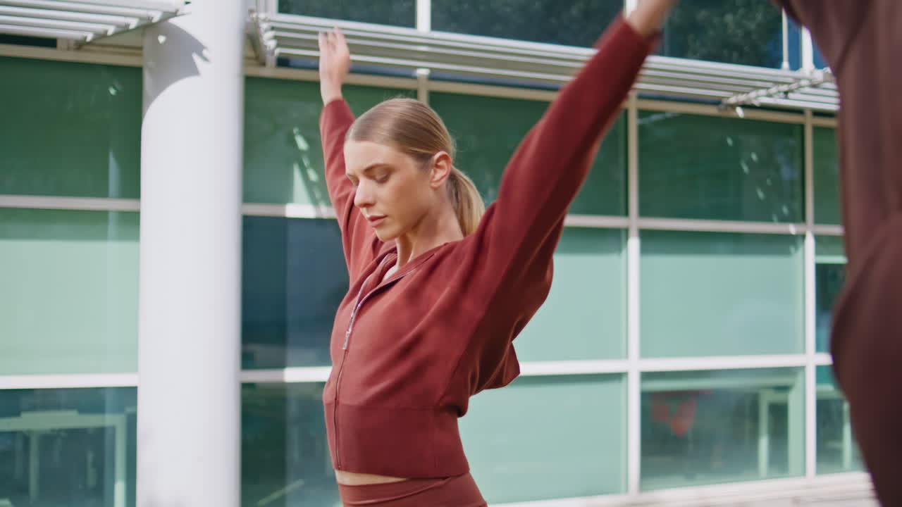 Closeup active people workout outdoors. Fit girl doing fitness exercise training