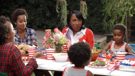 women and children talking at 4th july family barbecue