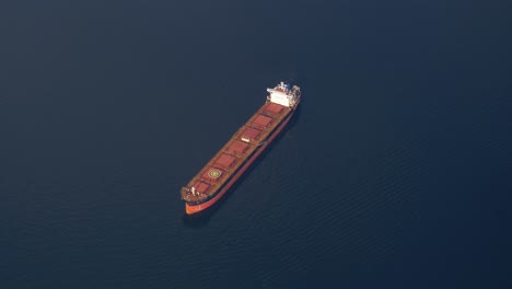 an oil tanker ship stranded in the water - aerial top view