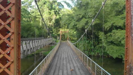 crossing over the blanchisseuse spring bridge in trinidad in the later afternoon