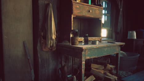 rustic interior with a wooden table and vintage items in a sunlit room