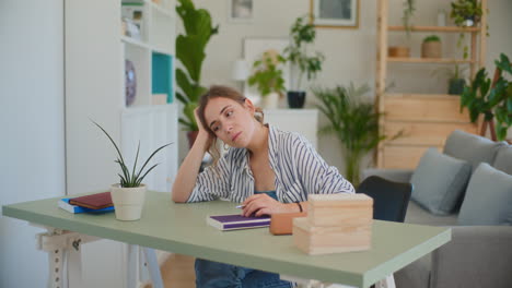 sad female student while learning