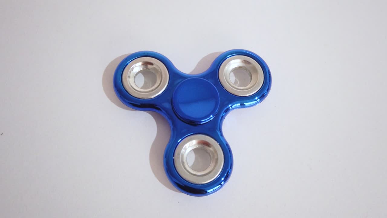 toy to relax known with spinner in blue color with white background.