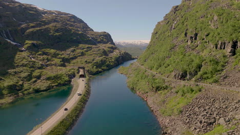 vehicles drive through a tunnel near roldasfjellet mountain, norway