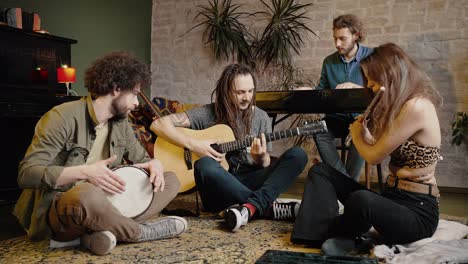 music jam. group of happy talented people playing musical instruments, enjoying rehearsal at home, tracking shot