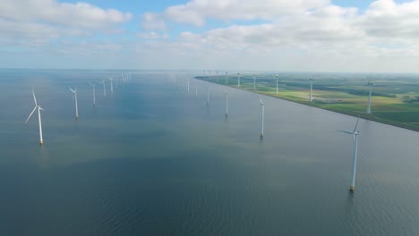 huge windmill turbines, offshore windmill farm in the ocean westermeerwind park , windmills isolated at sea on a beautiful bright day netherlands flevoland noordoostpolder