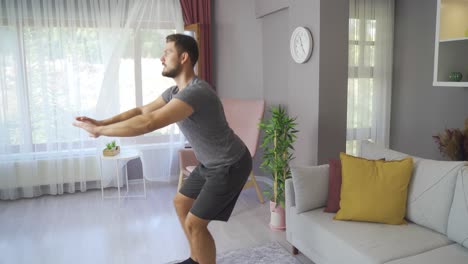 Young-man-exercising-at-home-does-Lunge-squat-exercise.