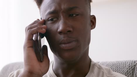 upset young man on phone call