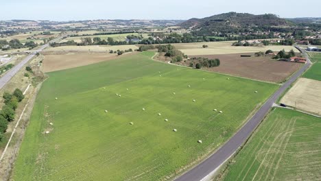 Drone-shot-of-french-farmland-with-hay-bales