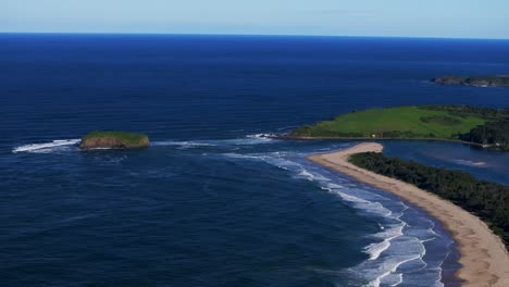 mystics waves surfing break stack rangoon island killalea minnamurra beach illawarra state park aerial drone shellharbour wollongong australia nsw south coast shell cove sunny blue sky circle right