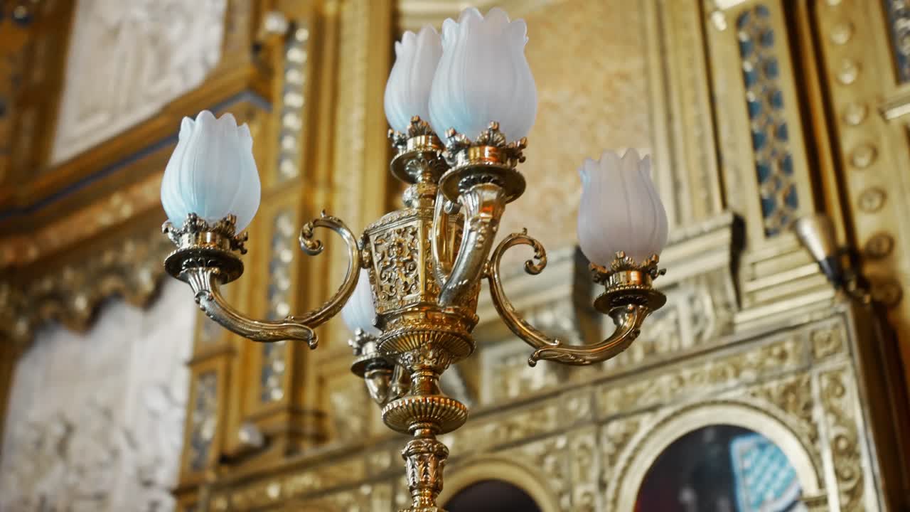 Close up of antique candelabrum inside la almudena cathedral in madrid.