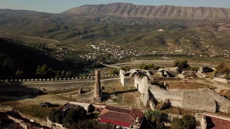 Drone-view-of-Herat-Castle,-Albania,-Balkans,-Europe-Ruins-of-red-mosque-and-reveal-of-town